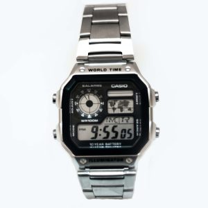 Casio digital watch with metal band on a white background